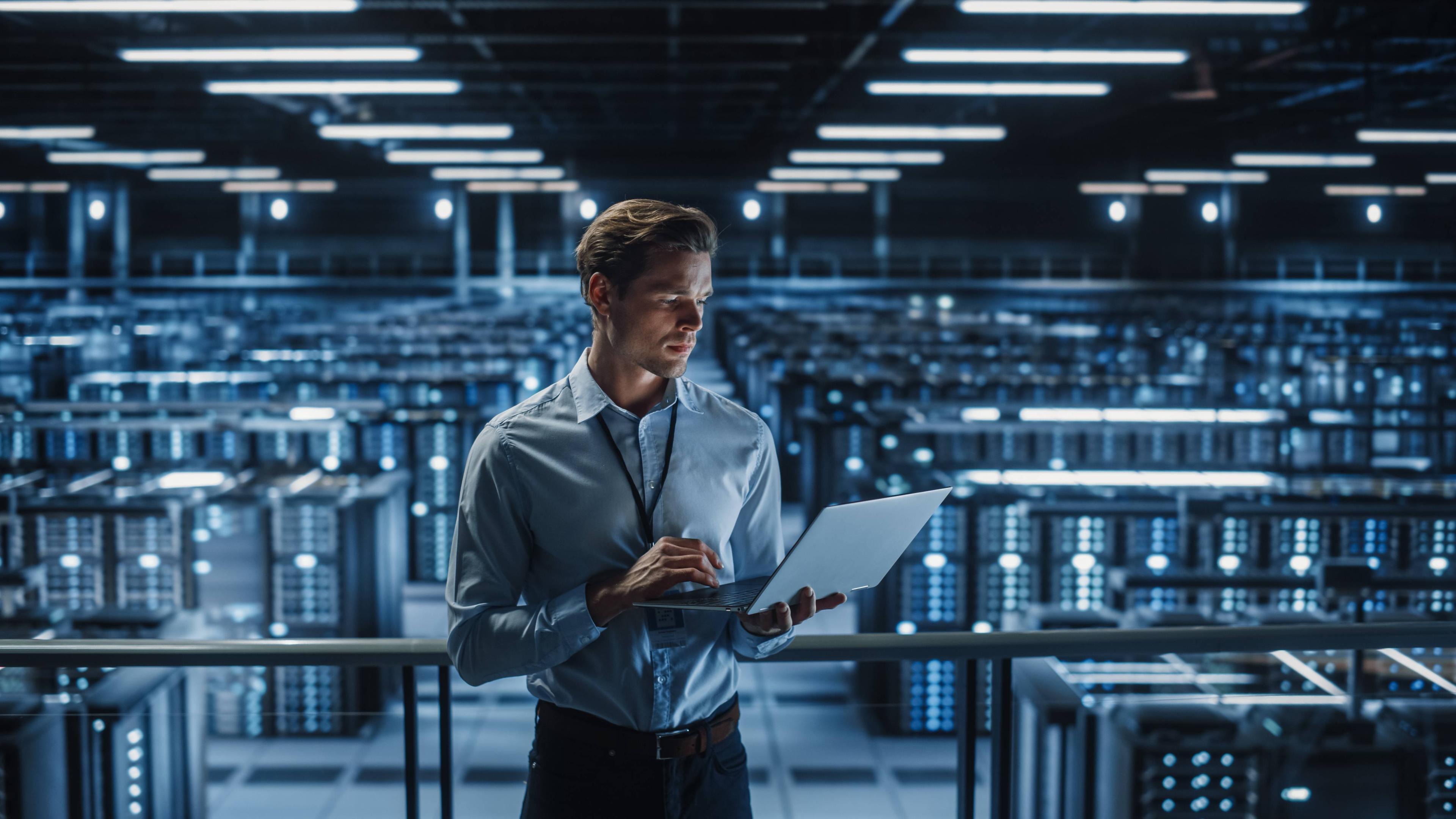 Man using laptop in factory