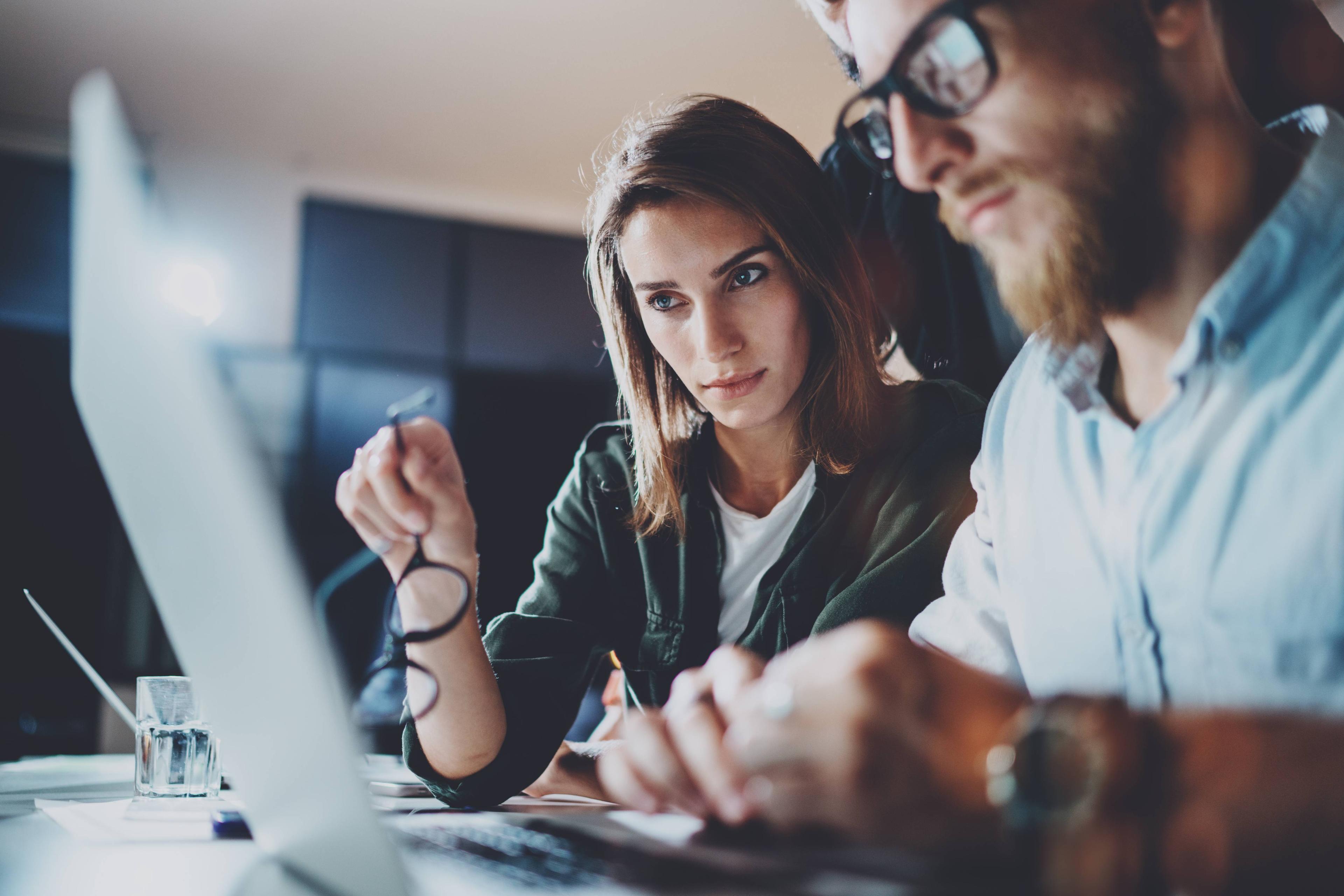 Man and woman looking at computer screen